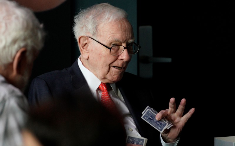 FILE PHOTO - Warren Buffett, CEO of Berkshire Hathaway Inc, gestures while playing bridge as part of the company annual meeting weekend in Omaha