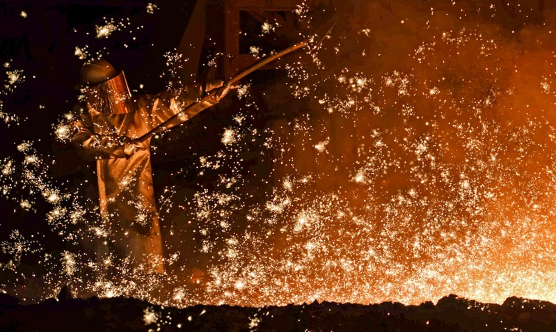 FILE PHOTO - A steel-worker is pictured at a furnace at the plant of German steel company Salzgitter AG in Salzgitter