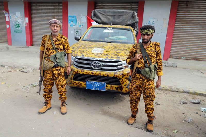 FILE PHOTO: Houthi allied police troopers secure a street in Hodeidah