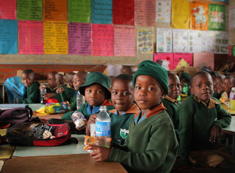 Pupils sit in a classroom at a government school in the capital city of Harare, Zimbabwe