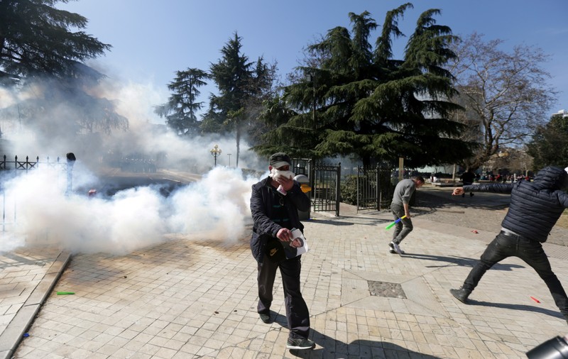 Supporters of the opposition party attend an anti-government protest in front of the Parliament in Tirana
