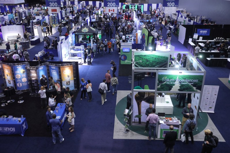 People view products at the Cannabis World Congress and Business Exposition, a trade show for the legalized adult use, medical marijuana and industrial hemp industries, in Los Angeles