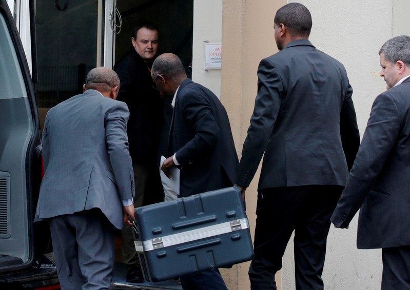 FILE PHOTO: Men unload a case containing the black boxes from the crashed Ethiopian Airlines Boeing 737 MAX 8 outside the headquarters of France's BEA air accident investigation agency in Le Bourget
