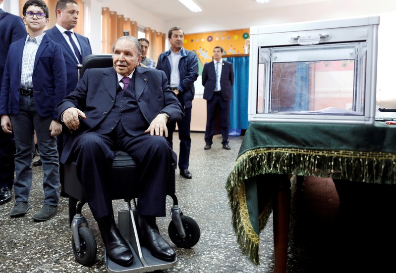 FILE PHOTO: Algeria's President Abdelaziz Bouteflika looks at journalists after casting his ballot during the parliamentary election in Algiers