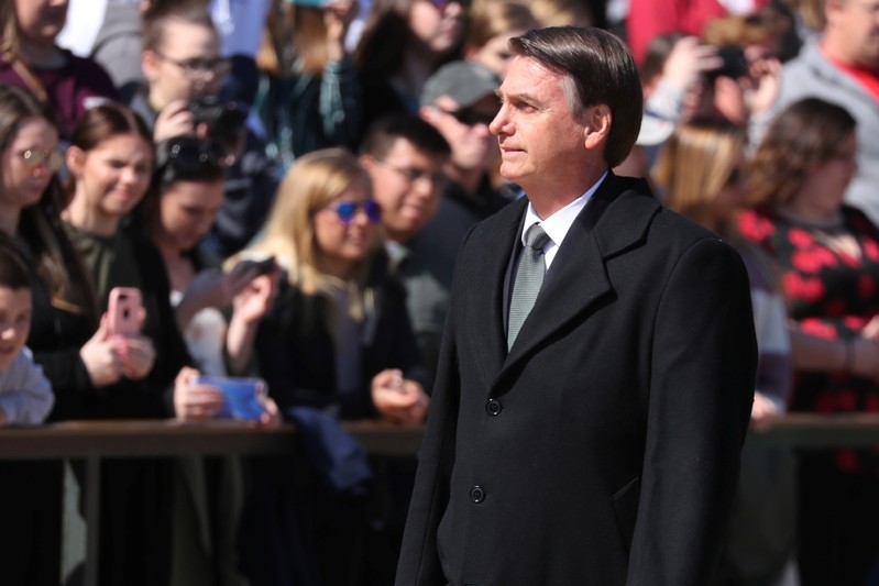 Brazil's President Jair Bolsonaro takes part in wreath laying at the Tomb of Unknown Soldier at Arlington National Cemetery