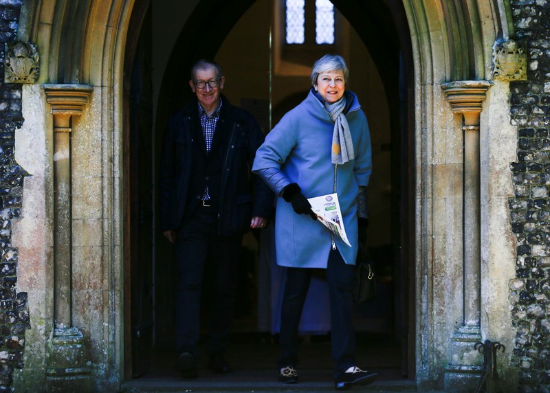 Britain's Prime Minister Theresa May and her husband Philip leave church in Sonning