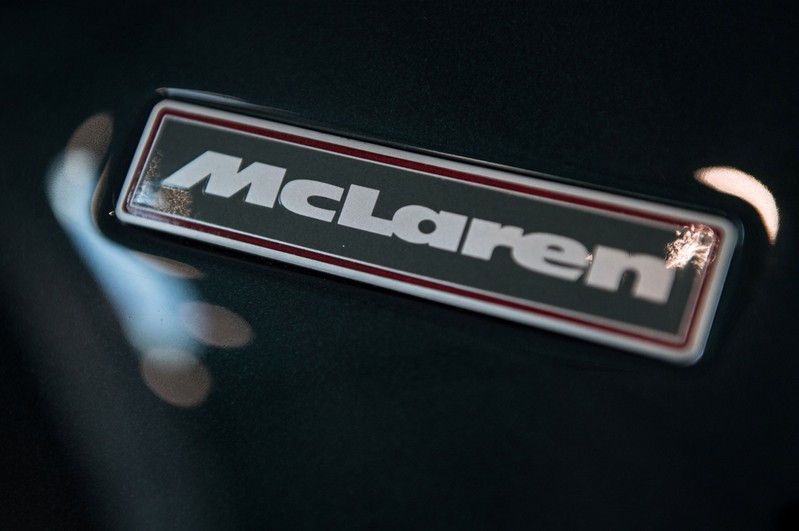 FILE PHOTO: A McLaren badge is seen on the bonnet of a car in a show room at the McLaren Technology Centre in Woking