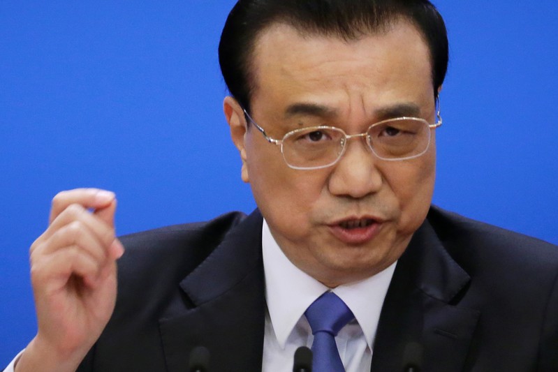 Chinese Premier Li Keqiang speaks at a news conference following the closing session of the National People's Congress (NPC) at the Great Hall of the People in Beijing