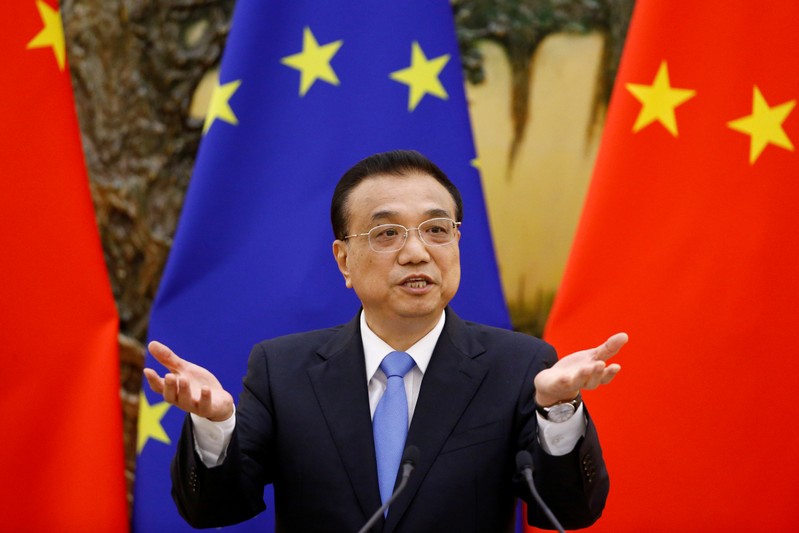 FILE PHOTO: Chinese Premier Li Keqiang attends a news conference at the Great Hall of the People in Beijing