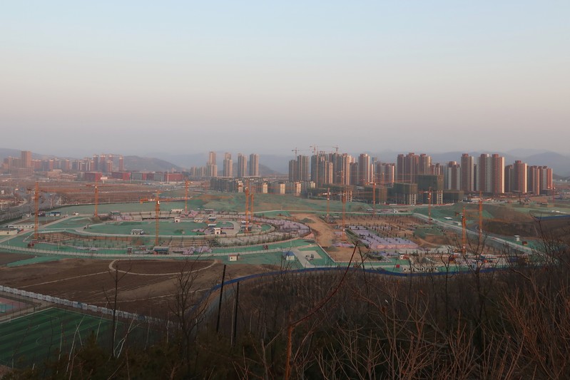 FILE PHOTO: School and residential buildings under construction are seen at Yanan New Zone