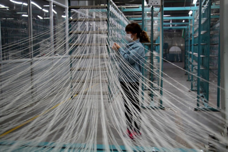 Woman works at a workshop of a textile manufacturer in Binzhou, Shandong