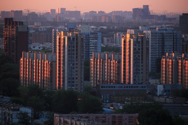 FILE PHOTO: Property buildings are seen against the dawn sky in Beijing