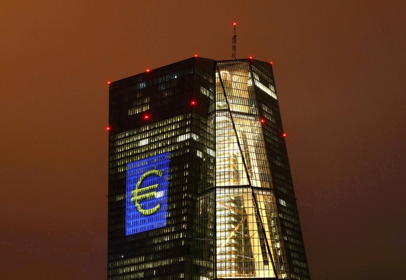 FILE PHOTO: Headquarters of the European Central Bank (ECB) are illuminated with a giant euro sign at the start of the 