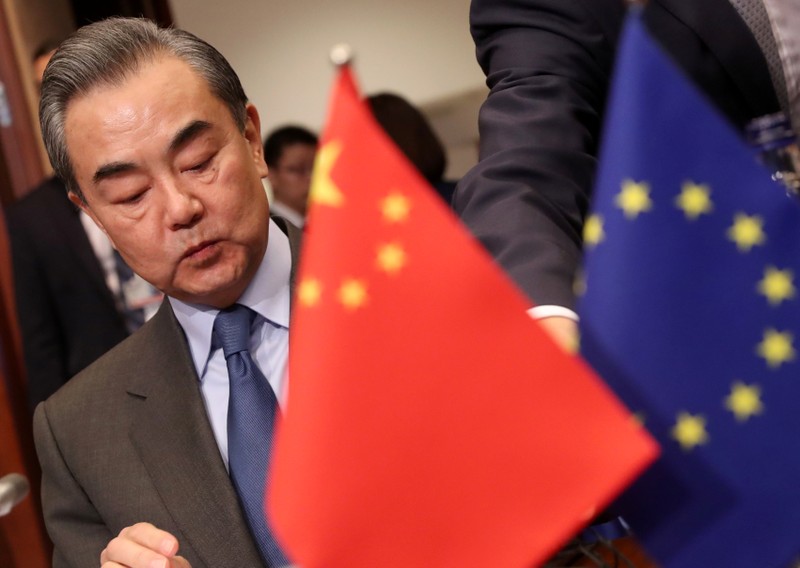 Chinese Foreign Minister Wang Yi attends a meeting with EU High Representative for Foreign Affairs and Security Policy Federica Mogherini in Brussels