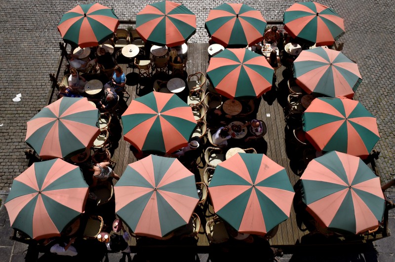 Terrace umbrellas are displayed during a hot and sunny day at the Grand Place in Brussels
