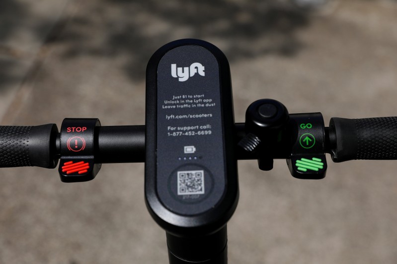 FILE PHOTO: An electric scooter from the ride sharing company Lyft is shown on a downtown sidewalk in San Diego