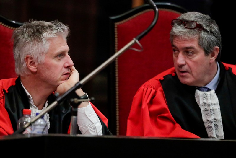 Belgian Public Prosecutors Yves Moreau and Bernard Michel are seen during the trial of Mehdi Nemmouche and Nacer Bendrer in Brussels