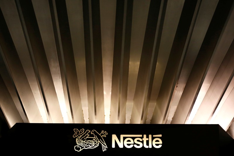 FILE PHOTO: The Nestle logo is pictured on the company headquarters entrance building in Vevey