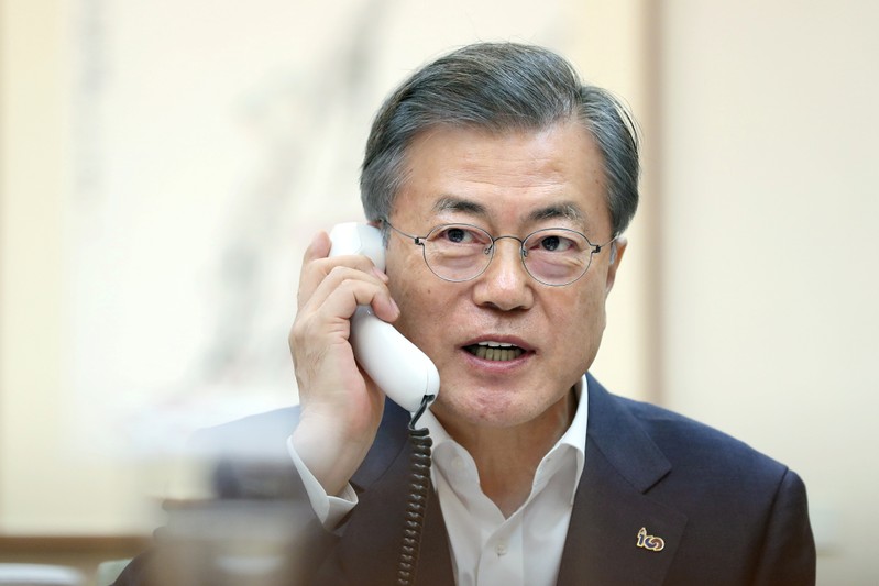 South Korean President Moon Jae-in talks on the phone with U.S. President Donald Trump at the Presidential Blue House in Seoul