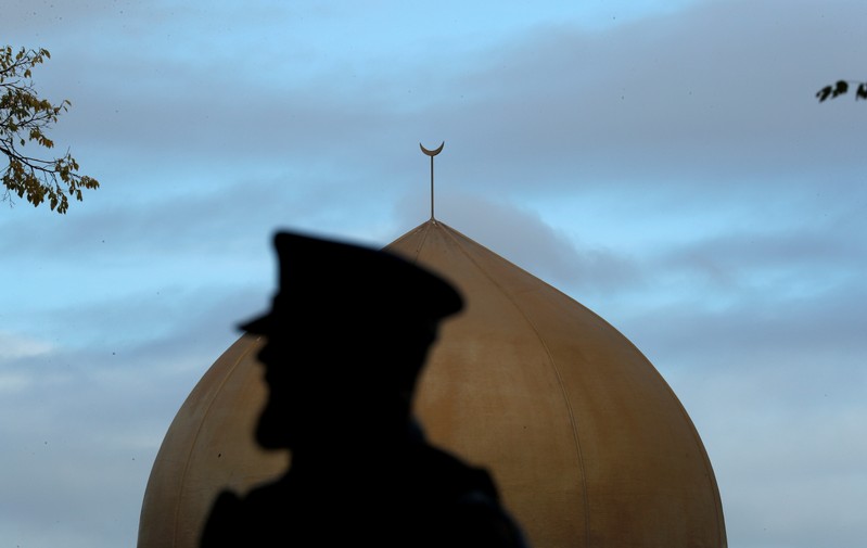 A police officer is pictured outside Masjid Al Noor mosque in Christchurch