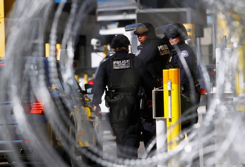 FILE PHOTO - U.S. Customs and Border Protection agents participate in a test deployment during a large-scale operational readiness exercise at the San Ysidro port of entry with Mexico in San Diego, California, U.S, as seen from Tijuana