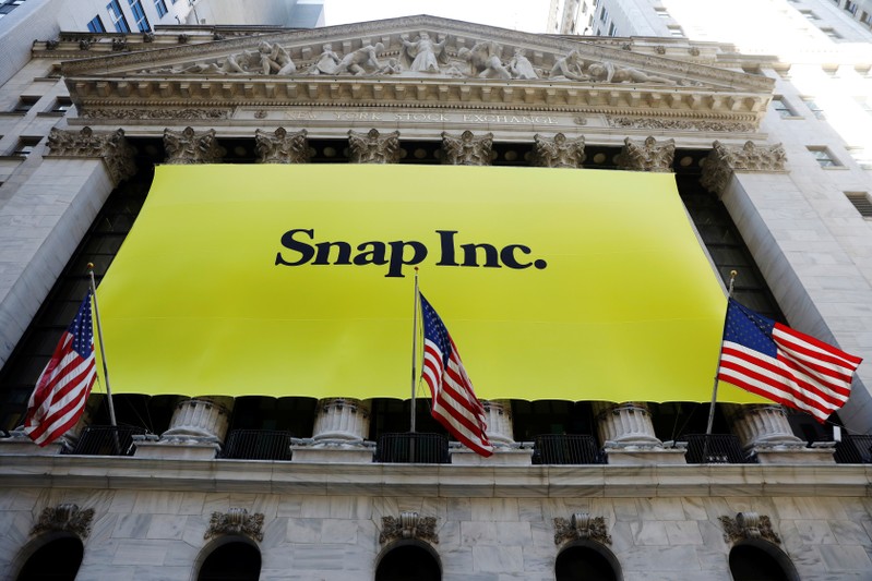 The front of the New York Stock Exchange (NYSE) with a Snap Inc. logo hung on the front of it stands shortly before the company's IPO in New York