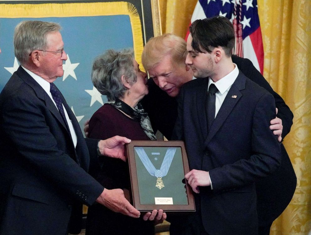 President Donald Trump leans in to talk with John and Elaine Atkins, the parents of the late Army Staff Sgt. Travis Atkins, as he presents them with the Medal of Honor in recognition of the battlefield actions and sacrifice of Sgt. Atkins, who gave his life to save fellow soldiers in Iraq in June 2007, during a ceremony in the White House in Washington, March 27, 2019.