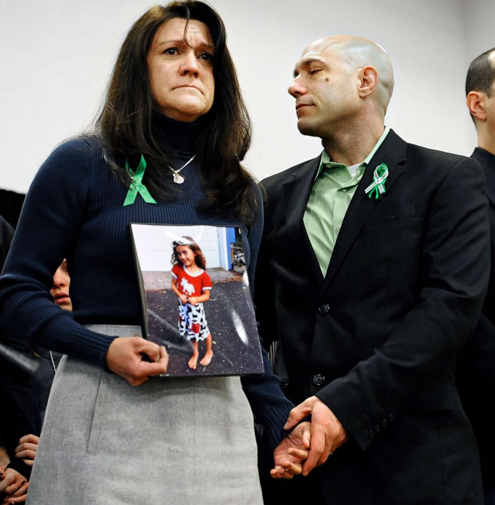 Jennifer Hensel and Jeremy Richman, parents of Sandy Hook School shooting victim Avielle Rose Richman, listen at a news conference at Edmond Town Hall in Newtown, Conn., Jan. 14, 2013.