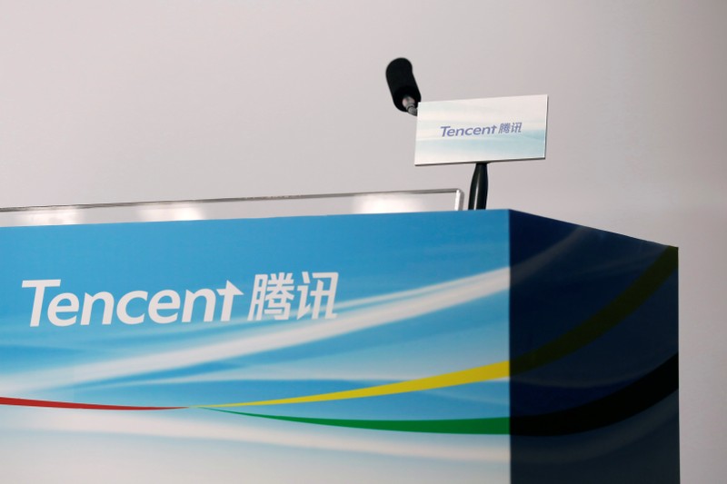 Logos of Tencent are displayed at a news conference in Hong Kong, China