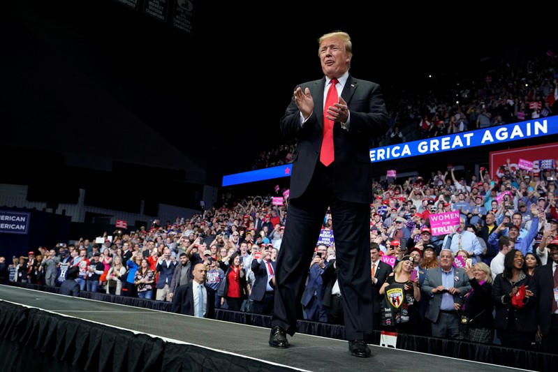 U.S. President Donald Trump arrives to speak at a campaign rally in Grand Rapids, Michigan