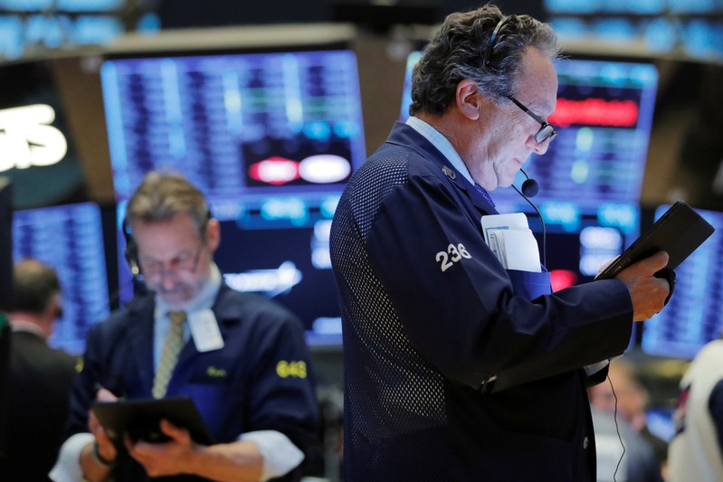 Traders work on the floor of the New York Stock Exchange (NYSE) shortly after the opening bell in New York