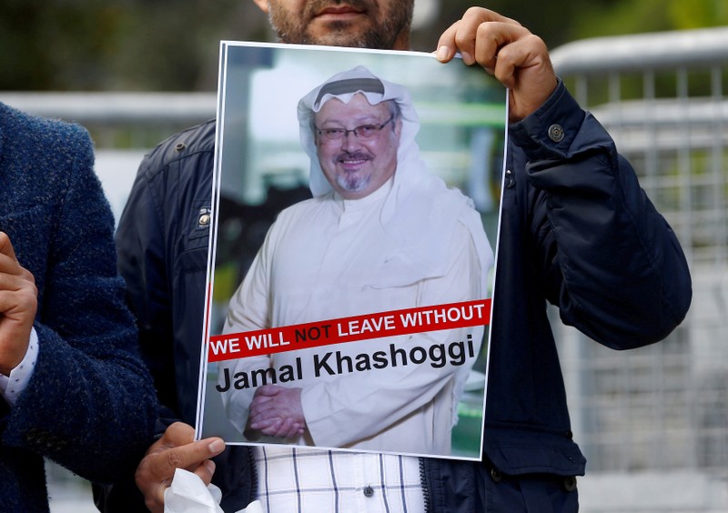 FILE PHOTO: A demonstrator holds picture of Saudi journalist Jamal Khashoggi during a protest in front of Saudi Arabia's consulate in Istanbul