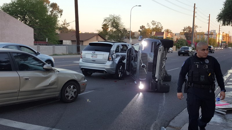 FILE PHOTO: A self-driven Volvo SUV owned and operated by Uber Technologies Inc. is flipped on its side after a collision in Tempe