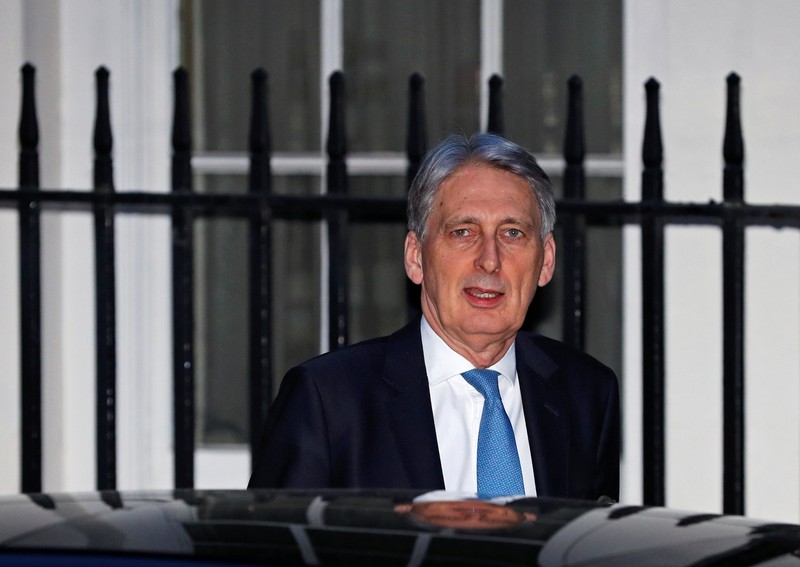 Britain's Chancellor of the Exchequer Philip Hammond leaves number 11 Downing St in London