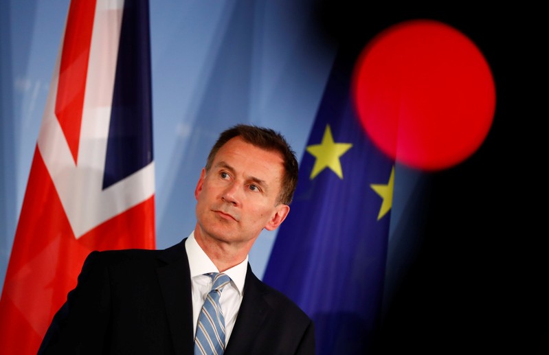Britain's Foreign Secretary Jeremy Hunt gives a statement to the media in Berlin
