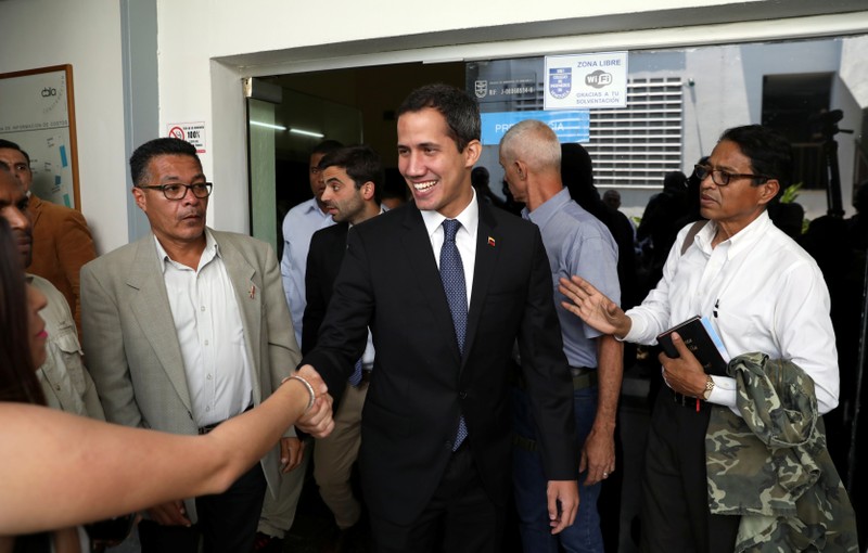 Venezuelan opposition leader Juan Guaido, who many nations have recognized as the country's rightful interim ruler, takes part in a meeting regarding the condition of the water and electricity systems in Caracas