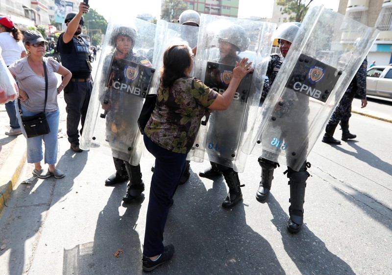 Opposition supporters clash with police in a rally against Venezuelan President Nicolas Maduro's government in Caraca