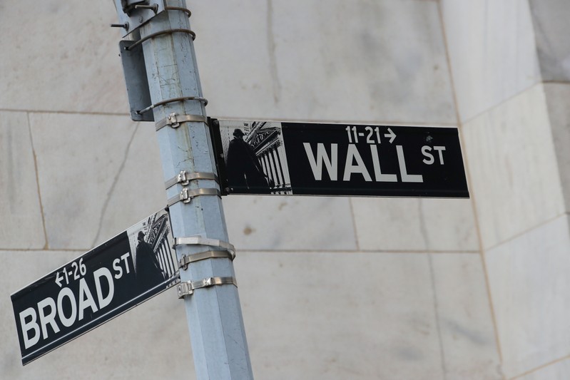 Street signs for Broad St. and Wall St. are seen outside of the NYSE in New York