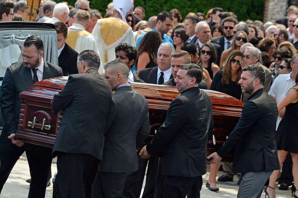 Mourners carry the casket of Karina Vetrano from St. Helen's Church following her funeral in the Howard Beach section of the Queens, New York, Aug. 6, 2016.