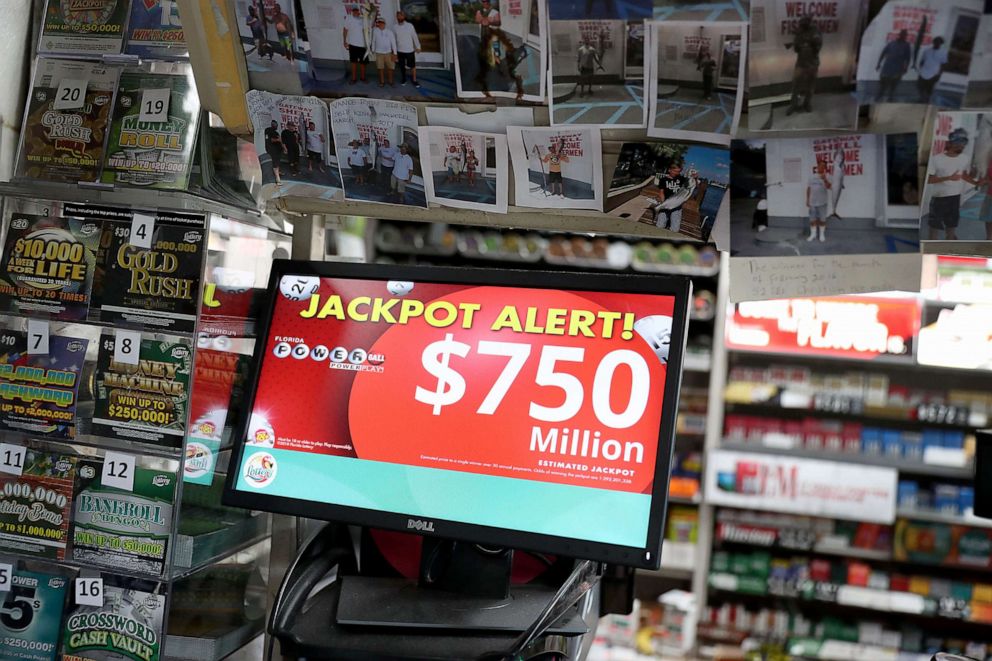 The Powerball jackpot is seen on a sign at the Shell Gateway store, March 26, 2019, in Boynton Beach, Florida.