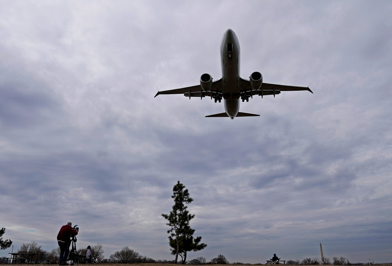 FILE PHOTO: An American Airlines Boeing 737 MAX 8 flight approaches for landing at Reagan National Airport in Washington