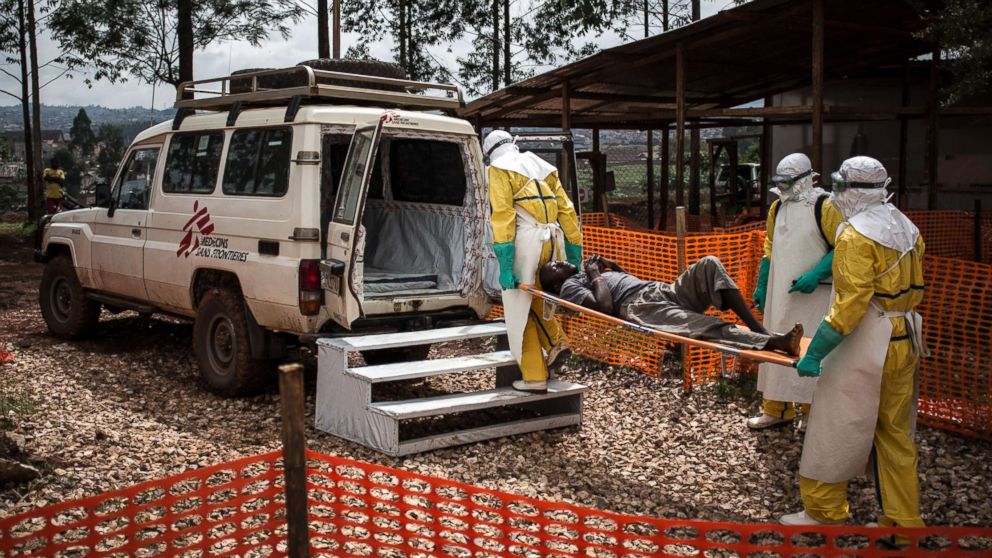 Health workers move a patient to a hospital after he was cleared of having Ebola inside of a Medecins Sans Frontieres supported Ebola treatment center in Butembo, Congo, Nov. 4, 2018.