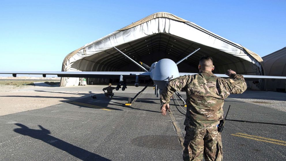 Airman 1st Class Johnathan, 386th Expeditionary Aircraft Maintenance Squadron crew chief, and Airman 1st Class Brandon, 386th EAMXS avionics specialist, conduct flight control checks while communicating with a 46th Expeditionary Attack Squadron pilot and sensor operator during preflight of a MQ-9 Reaper launch at an undisclosed location in Southwest Asia, Feb. 21, 2019.