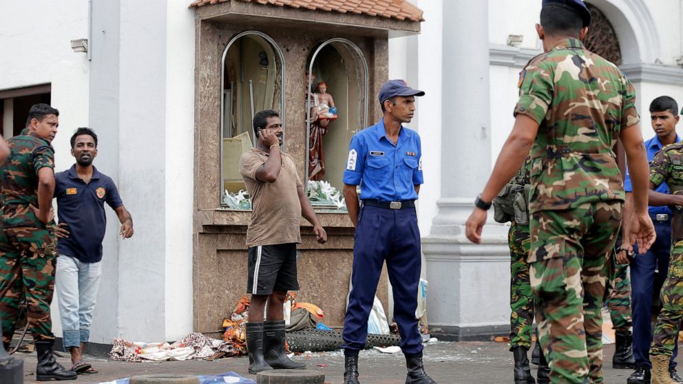 People gather outside St. Anthony's Shrine where a blast happened, in Colombo, Sri Lanka, Sunday, April 21, 2019. A Sri Lanka hospital spokesman says several blasts on Easter Sunday have killed dozens of people.