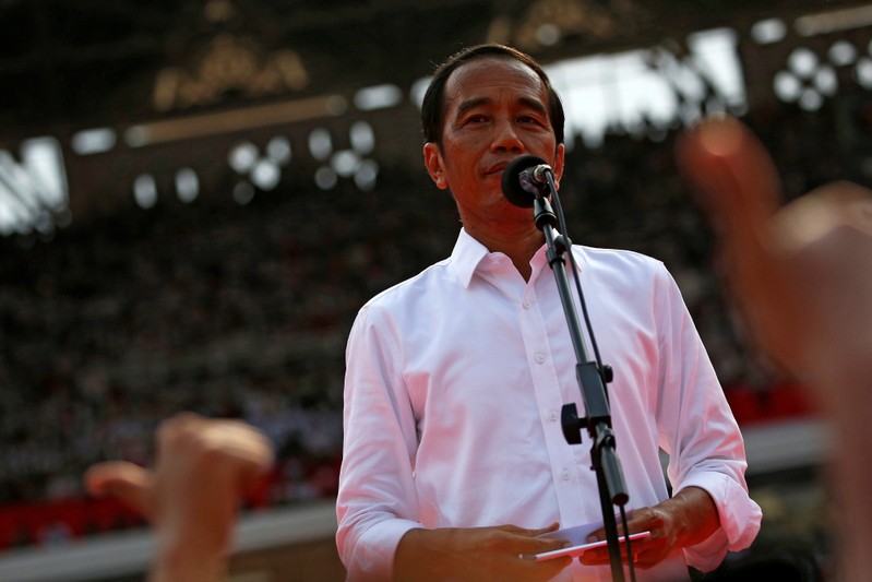 Indonesia's incumbent presidential candidate Joko Widodo reacts as he speaks during a campaign rally at Gelora Bung Karno stadium in Jakarta