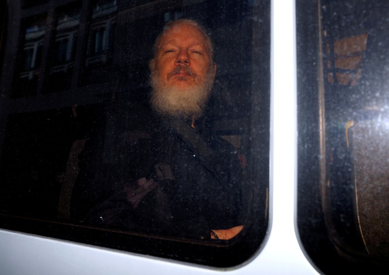 WikiLeaks founder Julian Assange is seen after was arrested by British police, outside Westminster Magistrates Court in London