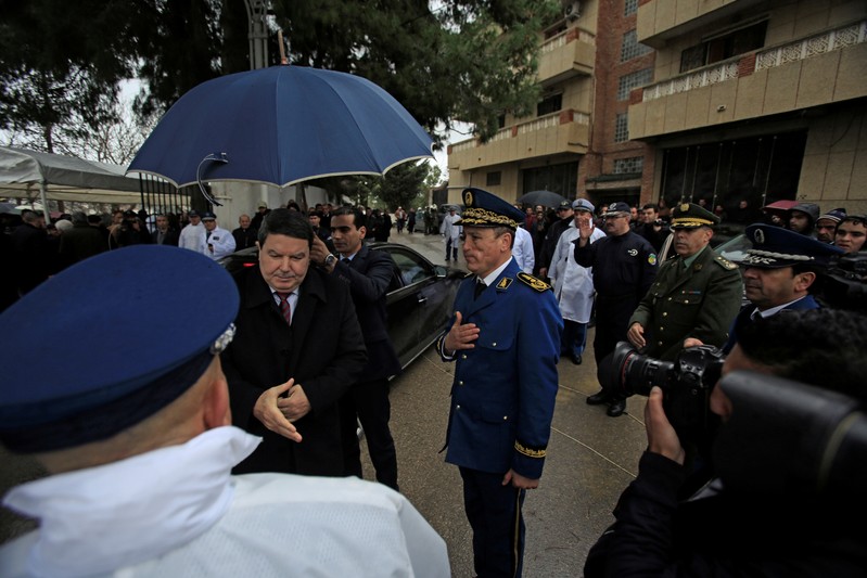 FILE PHOTO - Abdelghani Hamel, former Director General of the Algerian National Police (DGSN), greets a police officer in Algiers