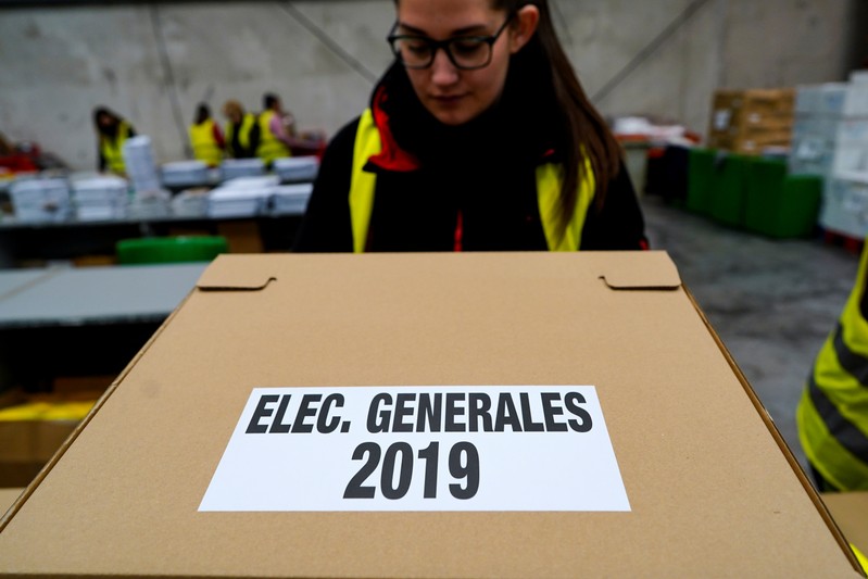 Worker moves boxes containing ballots before Spanish general election in Alcala de Henares