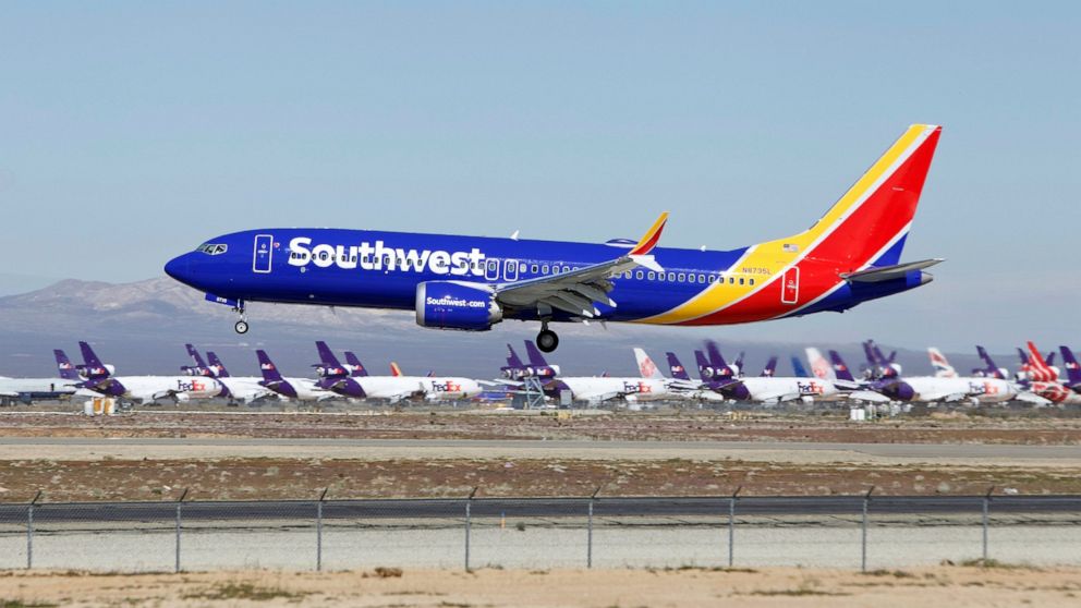 In this March 23, 2019 file photo a Southwest Airlines Boeing 737 Max aircraft lands at the Southern California Logistics Airport in the high desert town of Victorville, Calif.