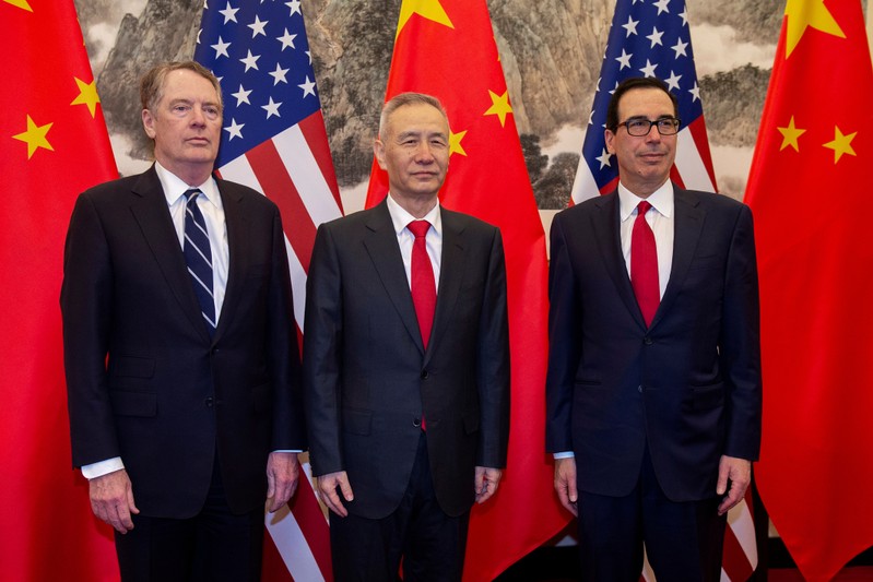 FILE PHOTO: China's Vice Premier Liu He (C) pose for a photo with U.S. Treasury Secretary Steven Mnuchin (R) and U.S. Trade Representative Robert Lighthizer (L) at Diaoyutai State Guesthouse in Beijing